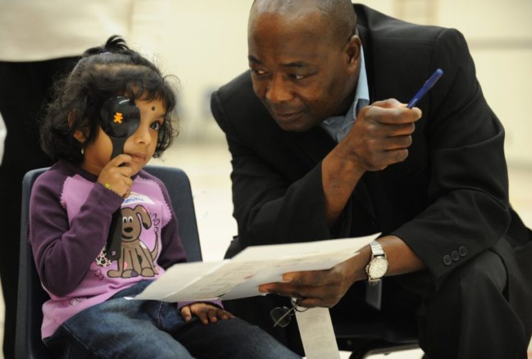 Sept 30 2008 pics of asmitha balakumar,4 gets her eyes tested by optician akwasi donkor boakye schoo