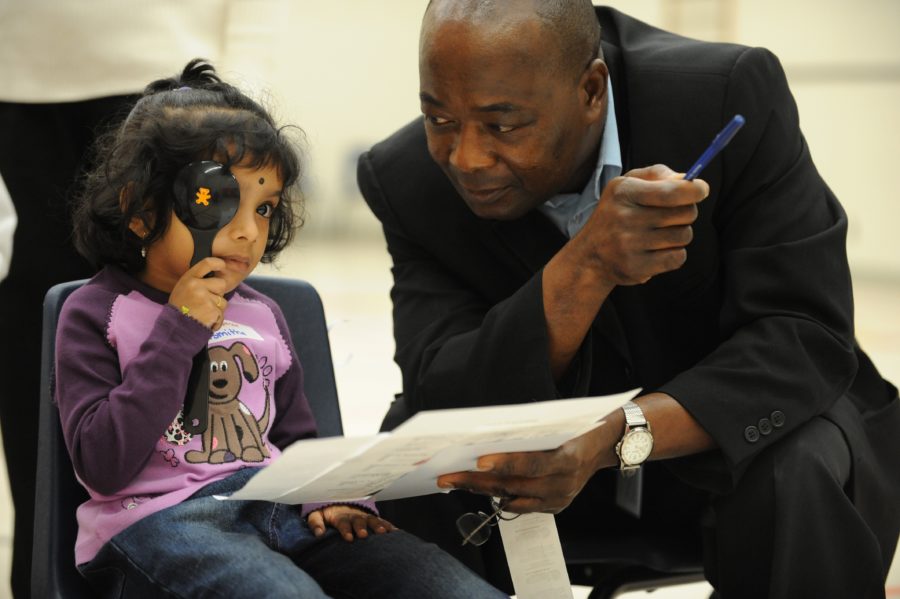 Sept 30 2008 pics of asmitha balakumar,4 gets her eyes tested by optician akwasi donkor boakye schoo